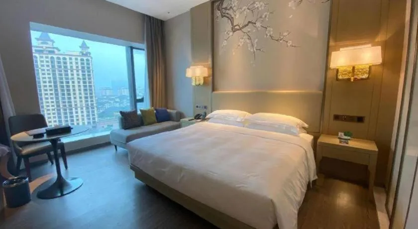 Bed in Derayco Hotel Foshan