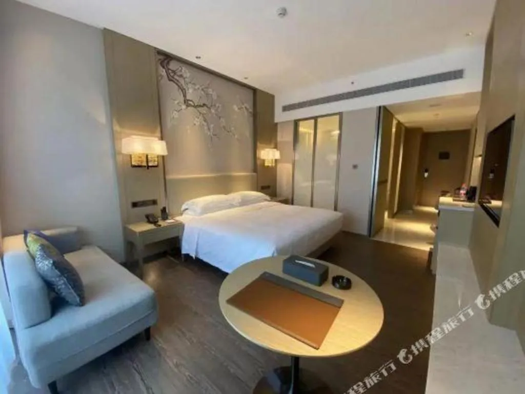 Bed in Derayco Hotel Foshan