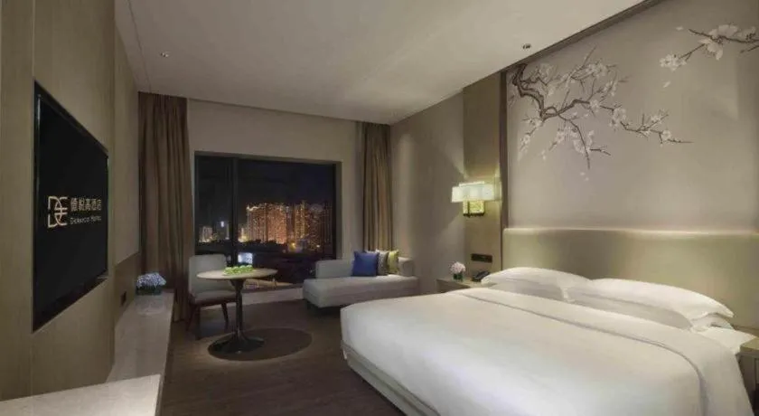 Bed in Derayco Hotel Foshan