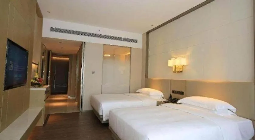 Bed in Derayco Hotel Foshan