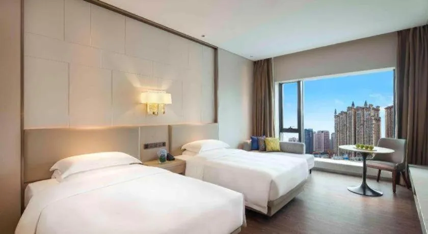 Bed in Derayco Hotel Foshan