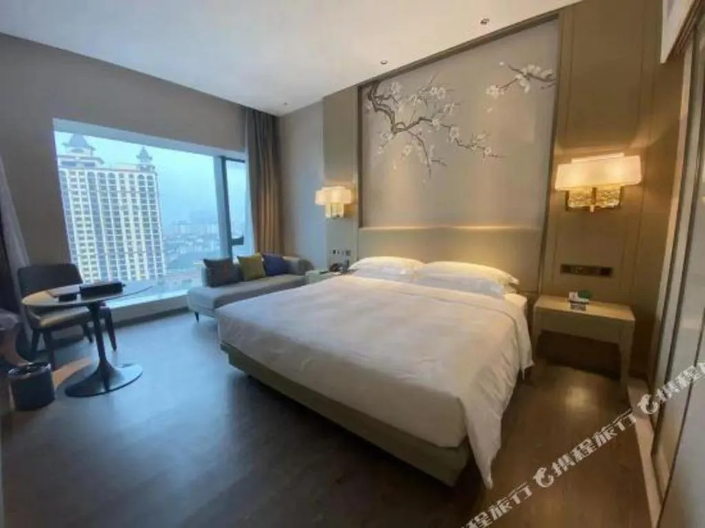 Bed in Derayco Hotel Foshan