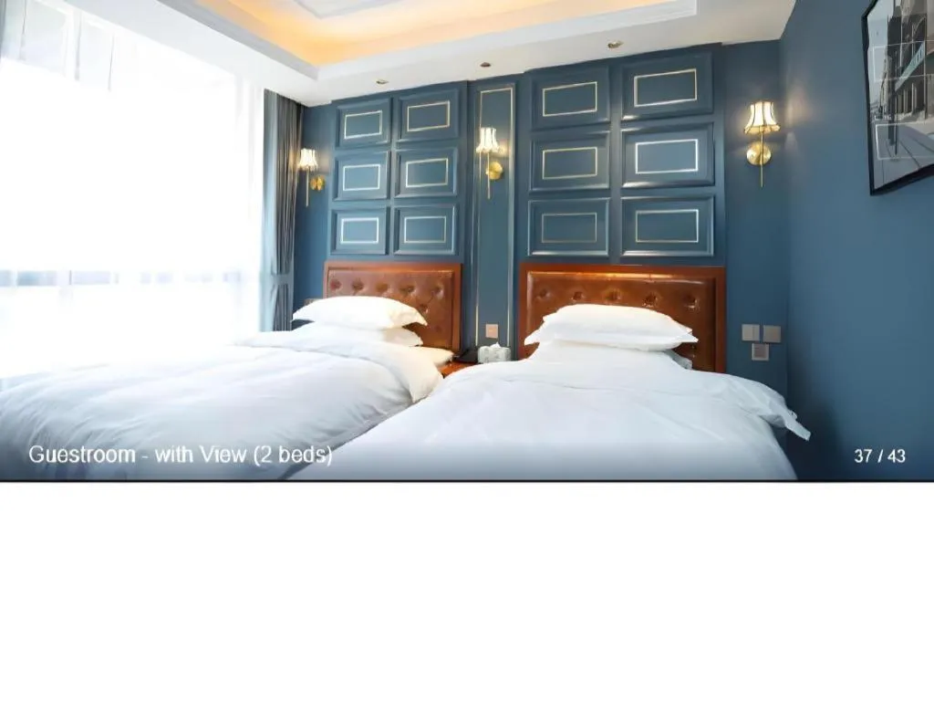 Bed in Yitingzhenshe Hotel Beijing Qianmen