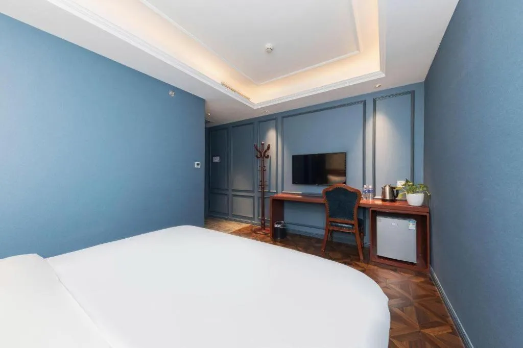 Bed in Yitingzhenshe Hotel Beijing Qianmen