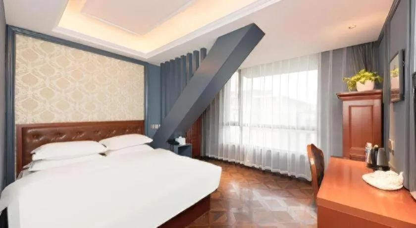 Bed in Yitingzhenshe Hotel Beijing Qianmen