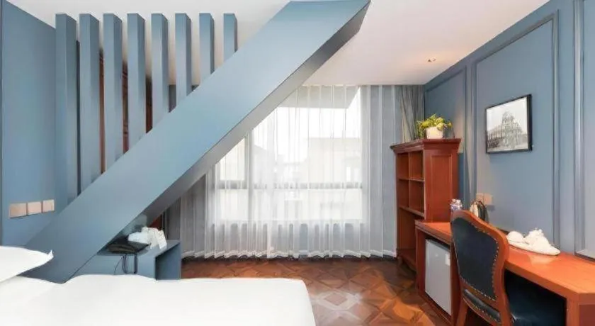 Bed in Yitingzhenshe Hotel Beijing Qianmen