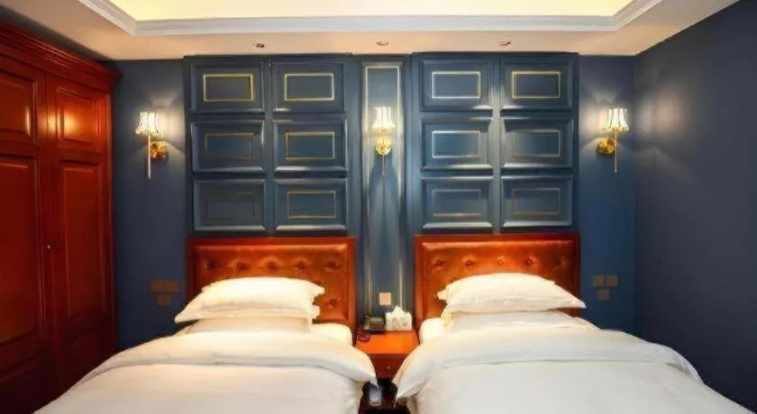 Bed in Yitingzhenshe Hotel Beijing Qianmen