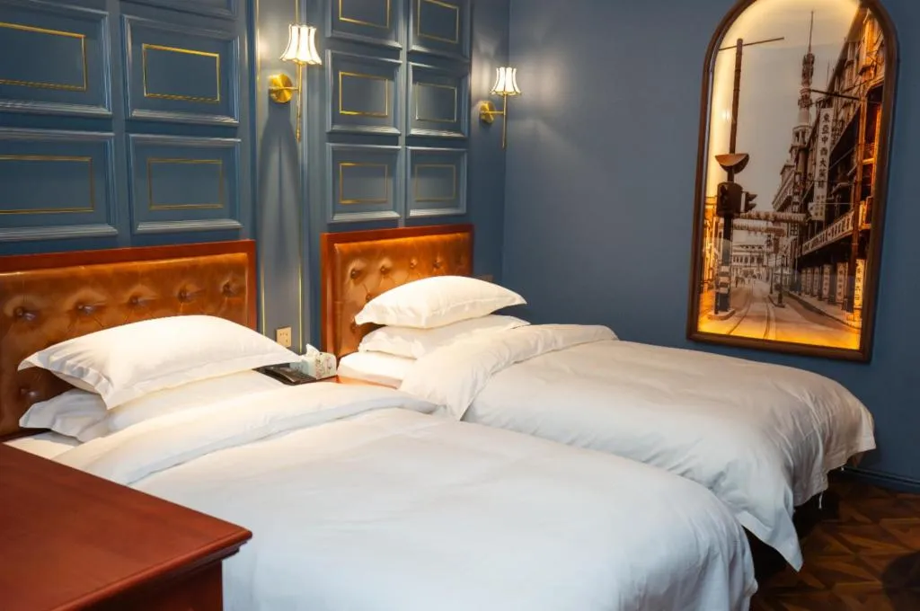 Bed in Yitingzhenshe Hotel Beijing Qianmen