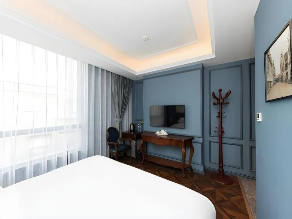 Bed in Yitingzhenshe Hotel Beijing Qianmen