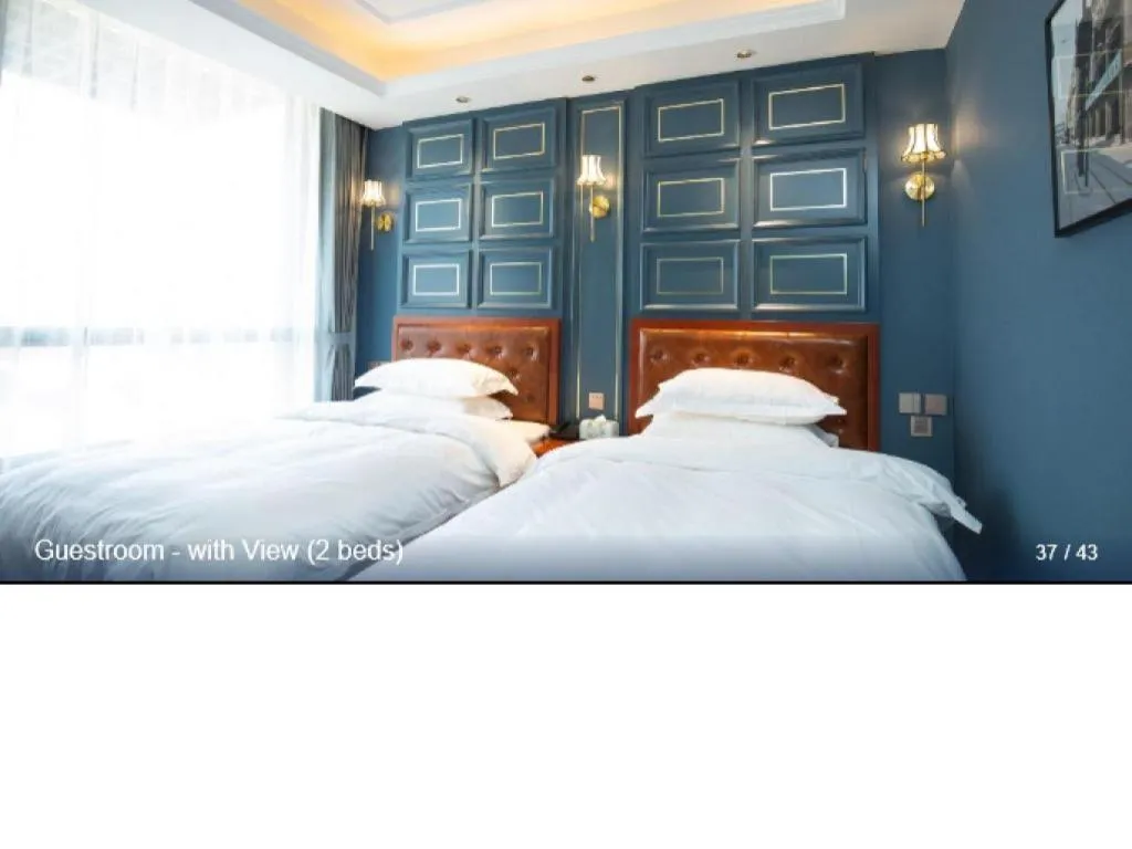 Bed in Yitingzhenshe Hotel Beijing Qianmen