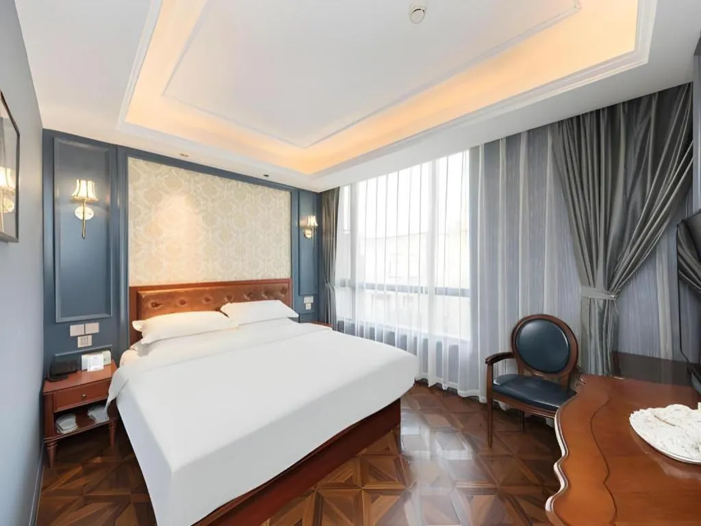 Bed in Yitingzhenshe Hotel Beijing Qianmen