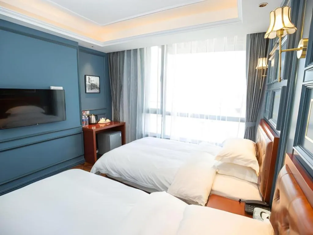 Bed in Yitingzhenshe Hotel Beijing Qianmen