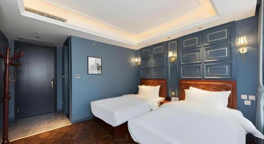 Bed in Yitingzhenshe Hotel Beijing Qianmen