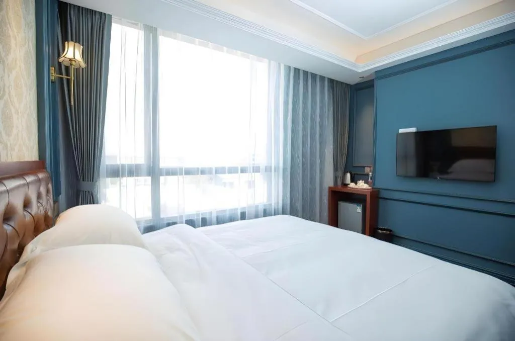 Bed in Yitingzhenshe Hotel Beijing Qianmen