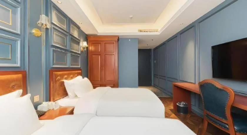 Bed in Yitingzhenshe Hotel Beijing Qianmen