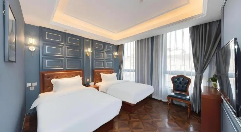 Bed in Yitingzhenshe Hotel Beijing Qianmen