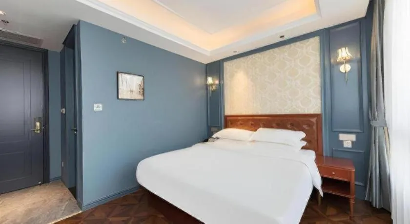 Bed in Yitingzhenshe Hotel Beijing Qianmen