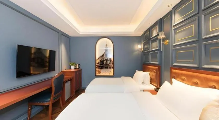 Bed in Yitingzhenshe Hotel Beijing Qianmen