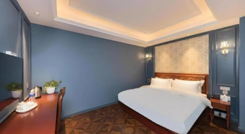 Bed in Yitingzhenshe Hotel Beijing Qianmen