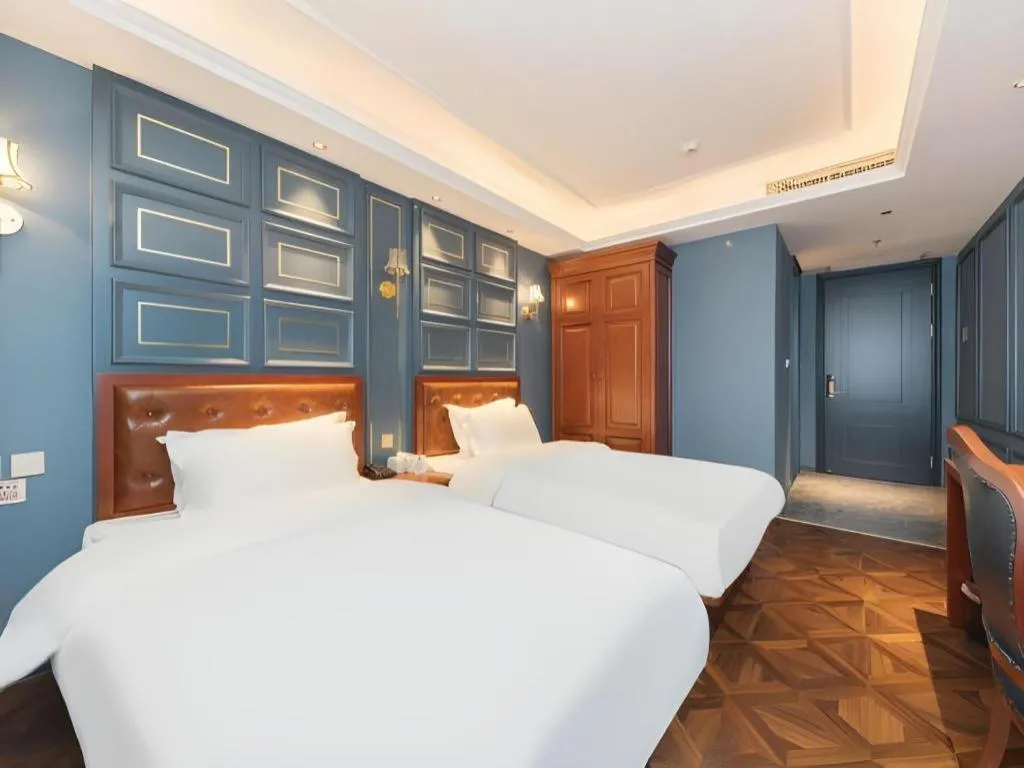 Bed in Yitingzhenshe Hotel Beijing Qianmen