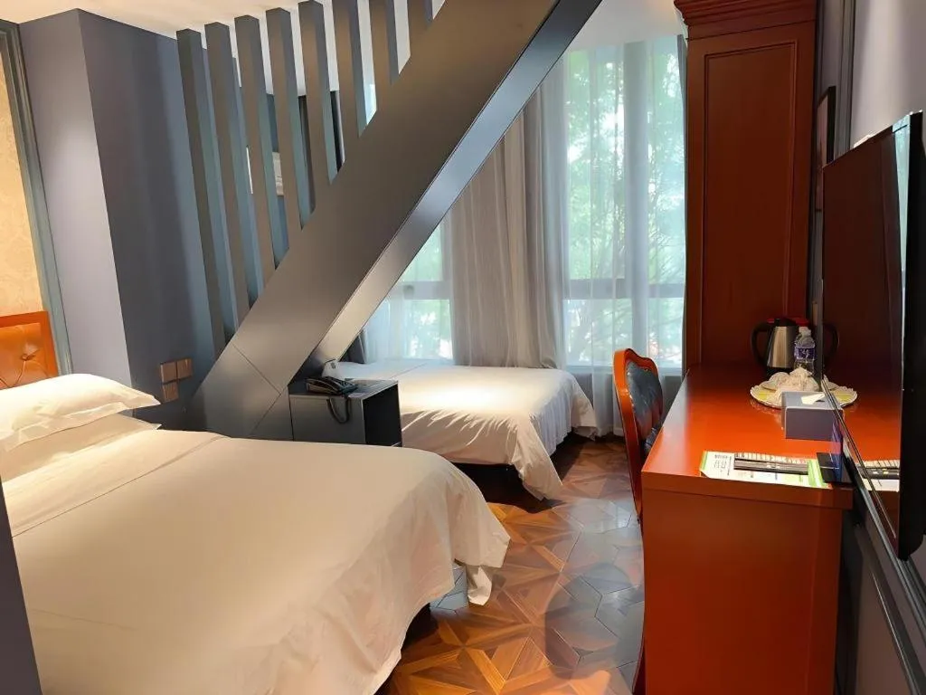 Bed in Yitingzhenshe Hotel Beijing Qianmen