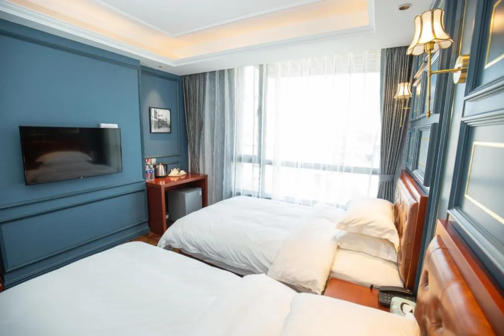 Bed in Yitingzhenshe Hotel Beijing Qianmen