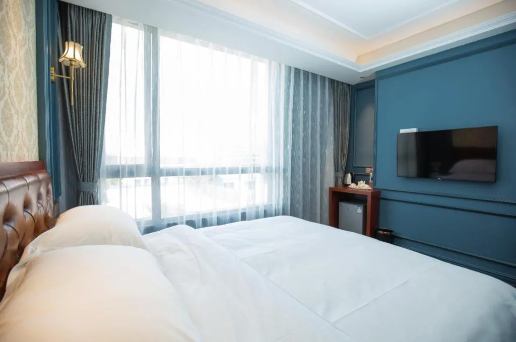 Bed in Yitingzhenshe Hotel Beijing Qianmen