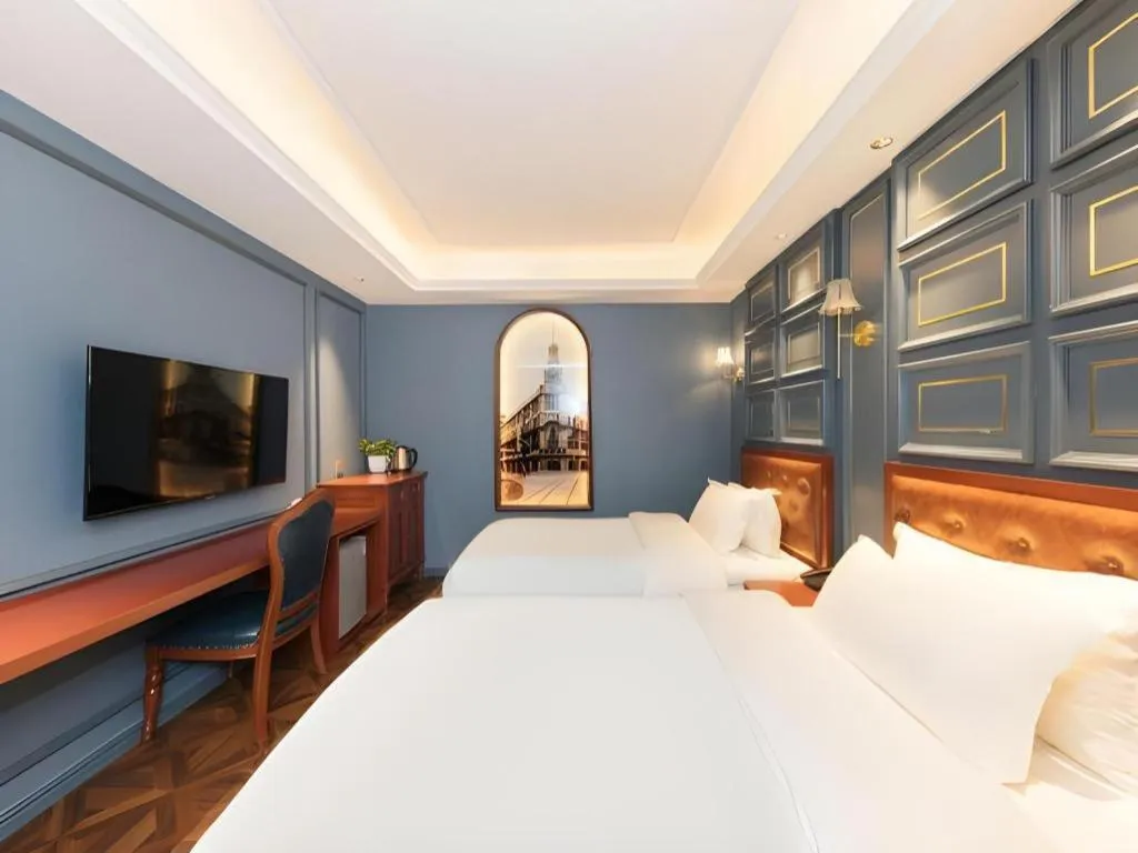 Bed in Yitingzhenshe Hotel Beijing Qianmen