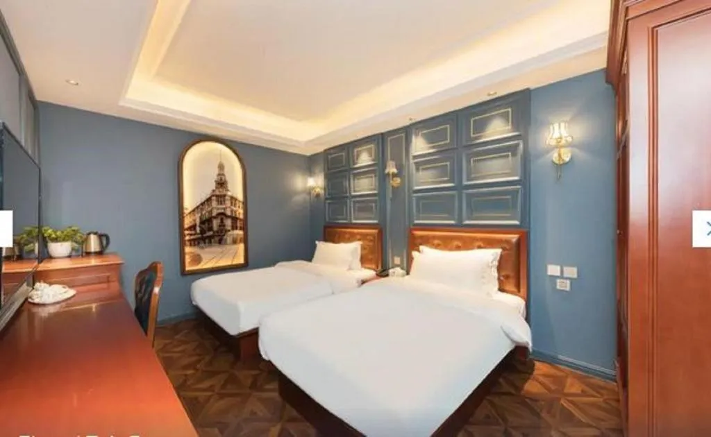 Bed in Yitingzhenshe Hotel Beijing Qianmen