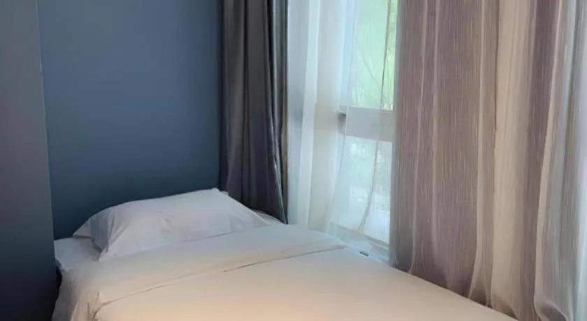 Bed in Yitingzhenshe Hotel Beijing Qianmen