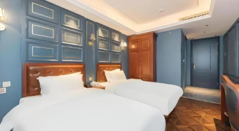 Bed in Yitingzhenshe Hotel Beijing Qianmen