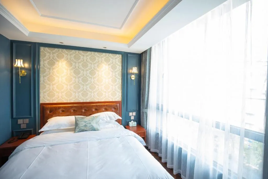 Bed in Yitingzhenshe Hotel Beijing Qianmen