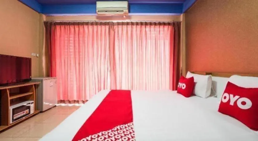 Bed in OYO 826 Cozy Rooms