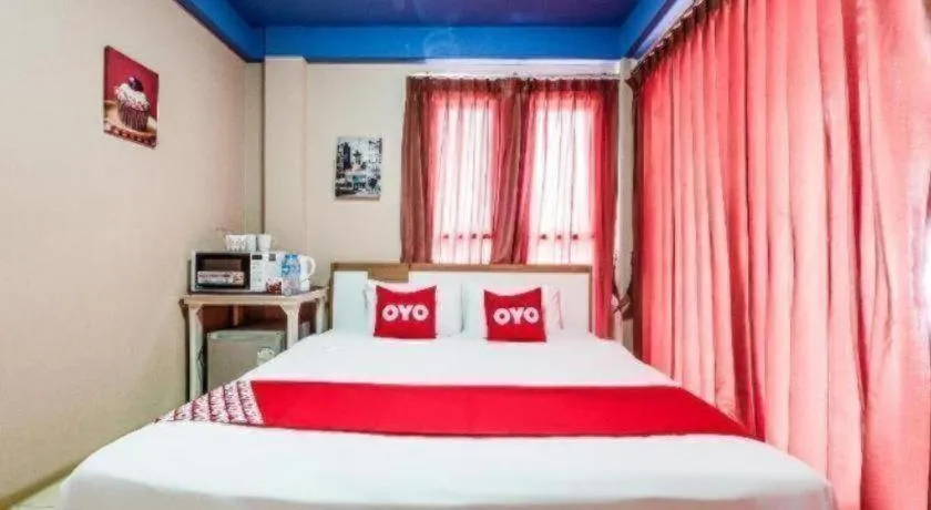 Bed in OYO 826 Cozy Rooms