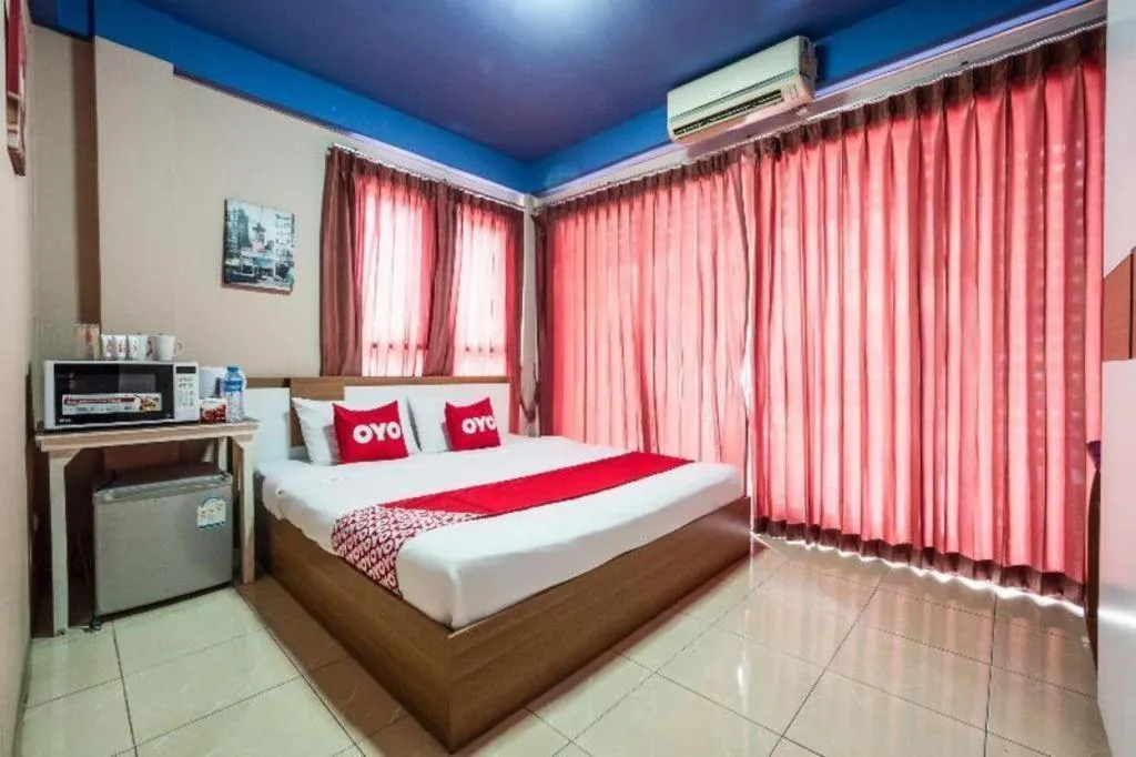 Bed in OYO 826 Cozy Rooms