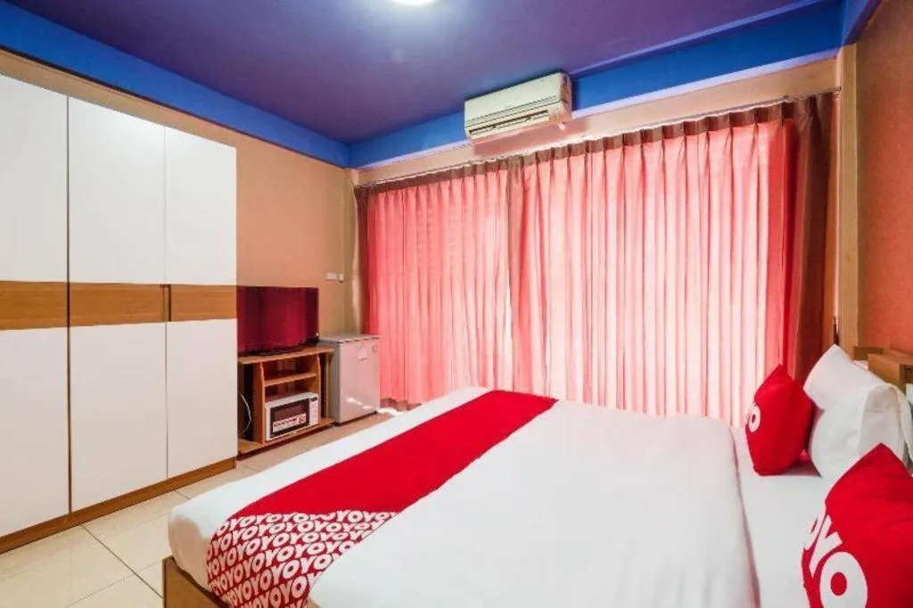 Bed in OYO 826 Cozy Rooms