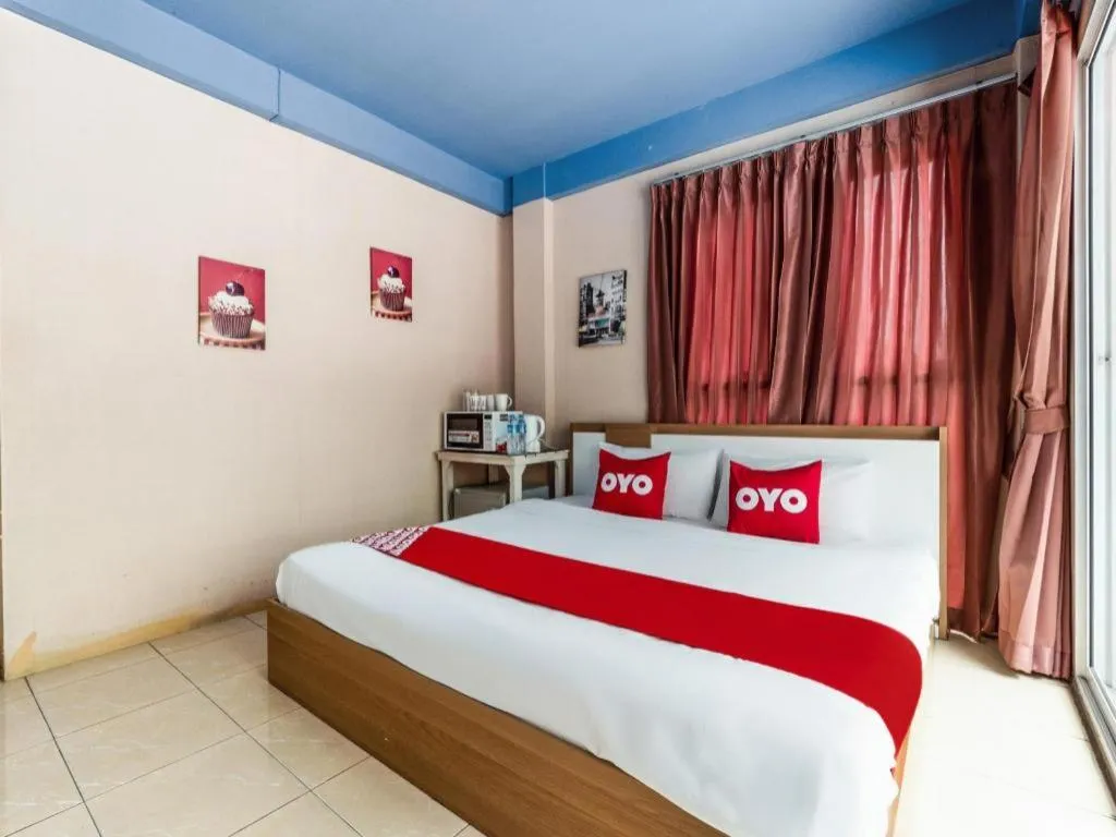 Bed in OYO 826 Cozy Rooms