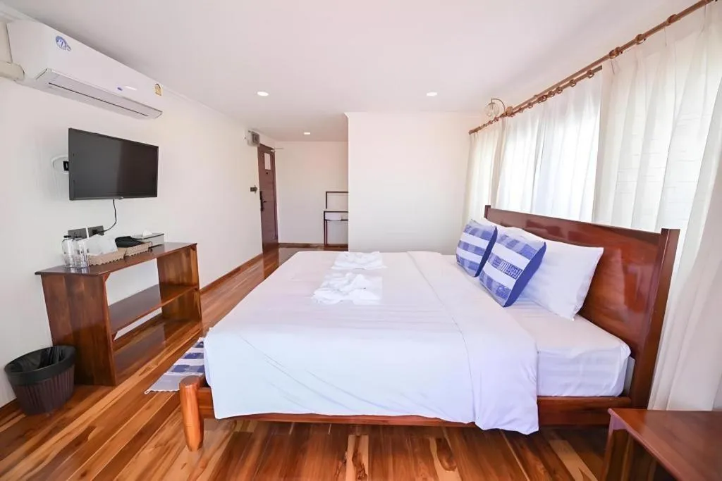 Bed in Chiangkhan Town Hotel