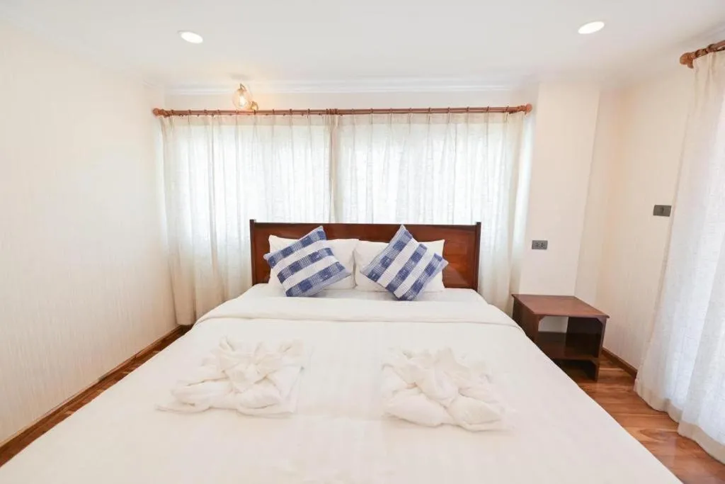 Bed in Chiangkhan Town Hotel