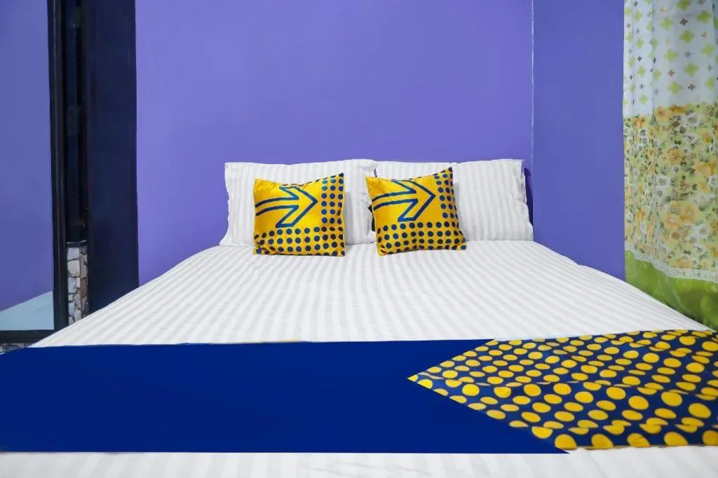 Bed in Hotel O Kost Qiu Qiu 99