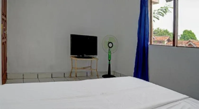 Bed in Hotel O Home Stay Syariah Aom Kusman