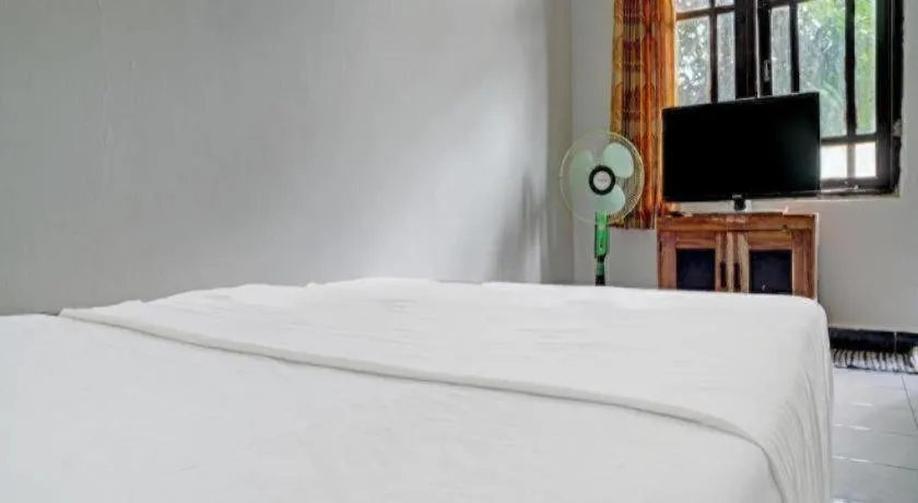 Bed in Hotel O Home Stay Syariah Aom Kusman