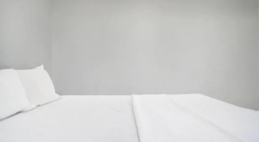 Bed in Hotel O Home Stay Syariah Aom Kusman