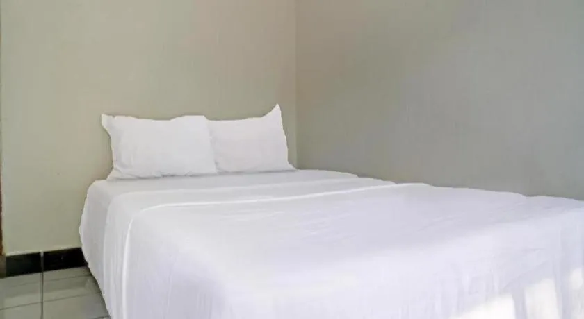Bed in Hotel O Home Stay Syariah Aom Kusman