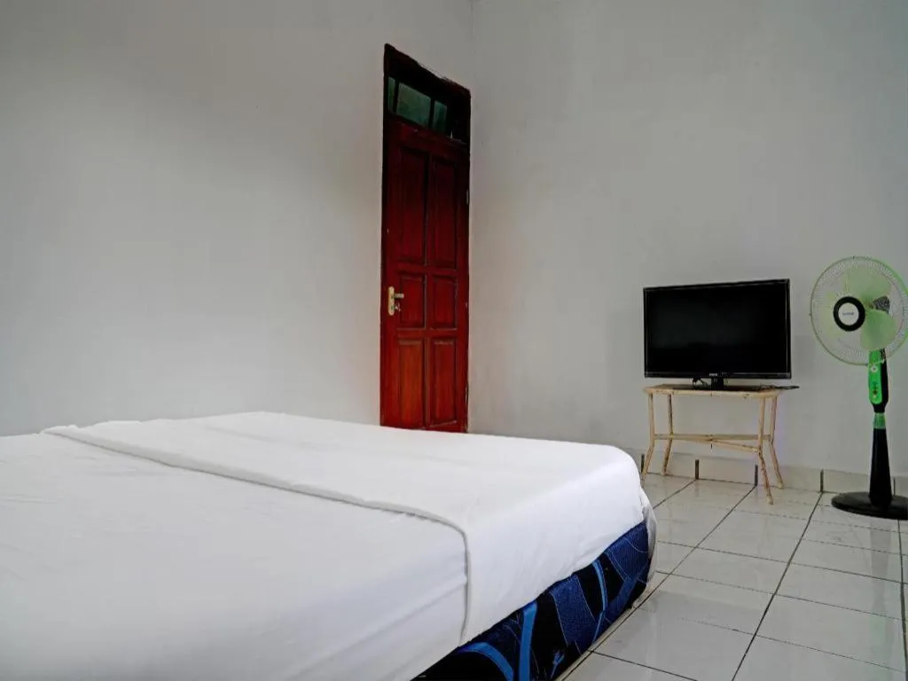 Bed in Hotel O Home Stay Syariah Aom Kusman
