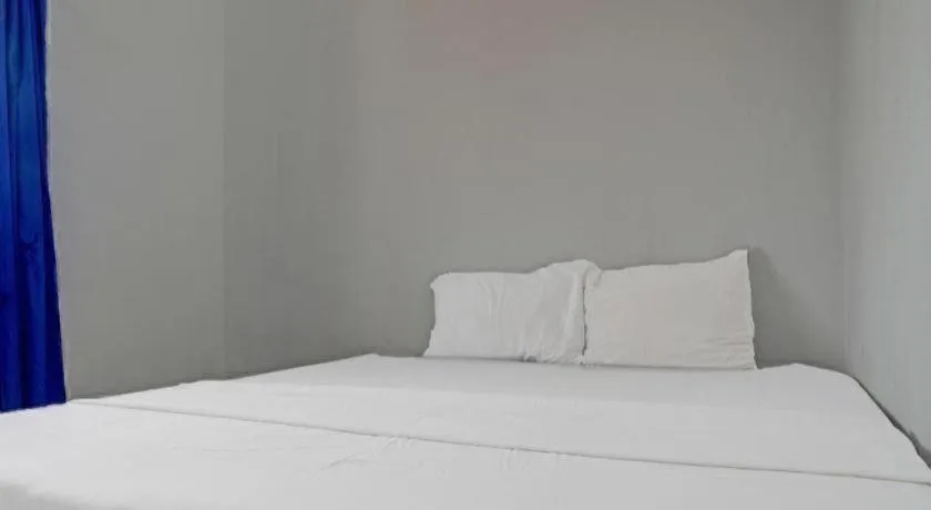 Bed in Hotel O Home Stay Syariah Aom Kusman