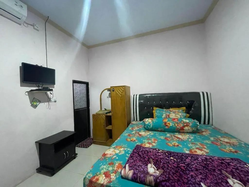 Bed in Hotel O Lima Saudara Syariah