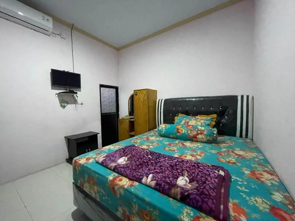 Bed in Hotel O Lima Saudara Syariah