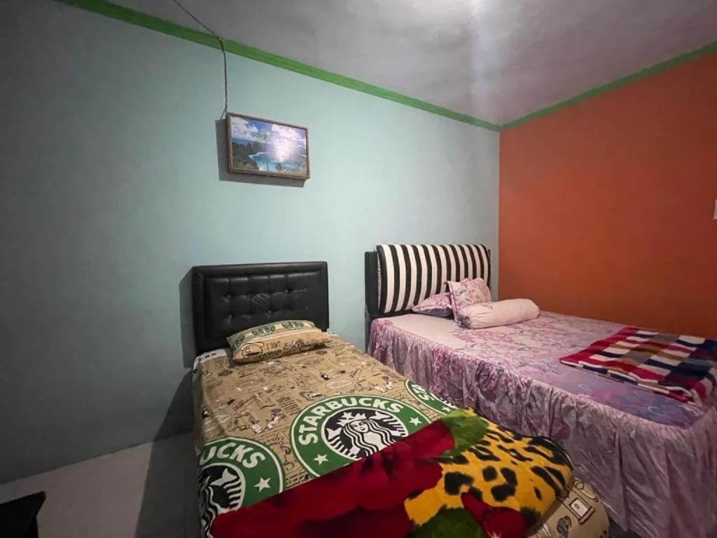 Bed in Hotel O Lima Saudara Syariah