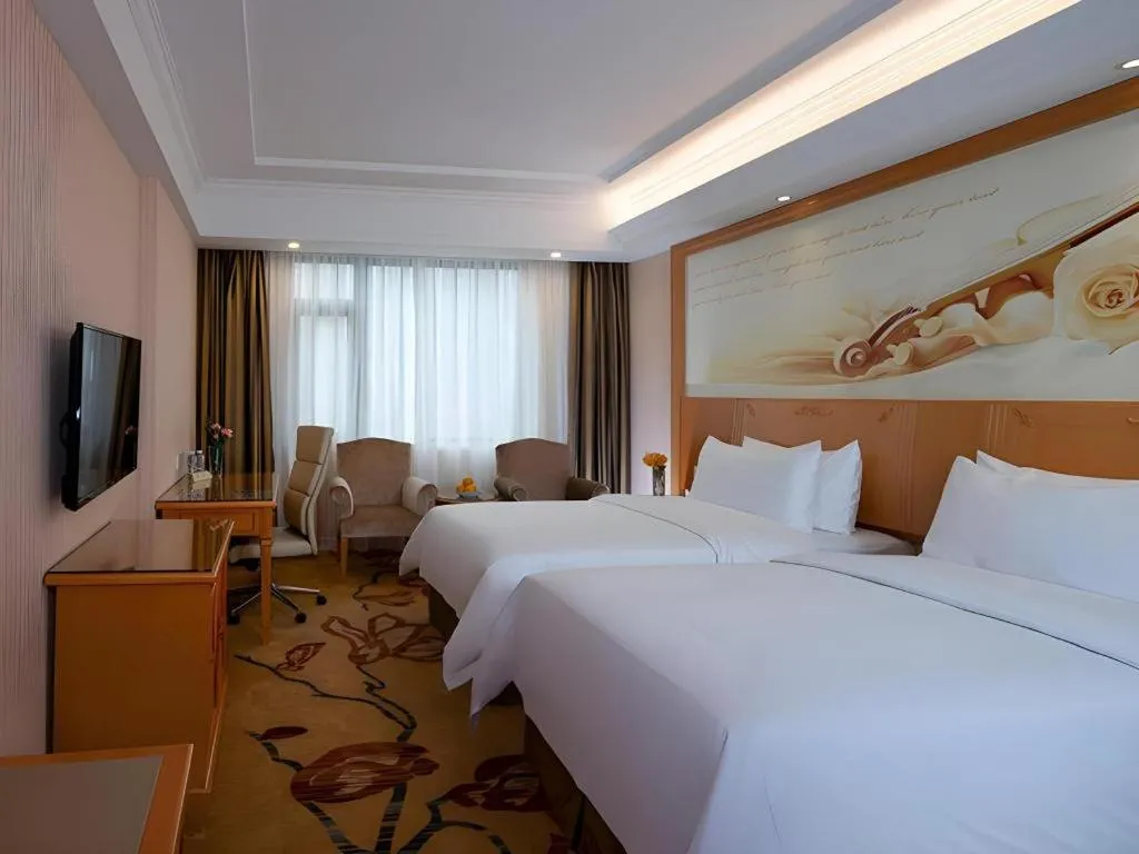Bed in Vienna Hotel Shenzhen Bao'an Airport Taoyuanju Pingluanshan Metro Station